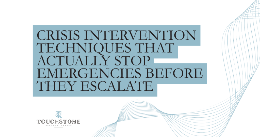 crisis-intervention-techniques-de-escalation-featured - Touchstone Recovery Center Promotional banner with a blue stepped rectangle containing the title: 'CRISIS INTERVENTION TECHNIQUES THAT ACTUALLY STOP EMERGENCIES BEFORE THEY ESCALATE'; Touchstone Recovery Center logo bottom left; blue decorative wave lines on the right.
